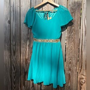 Elegant Teal Dress with Gold Accents